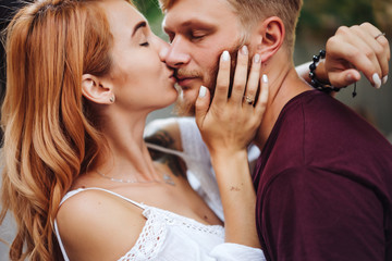beautiful couple posing outdoors, close view
