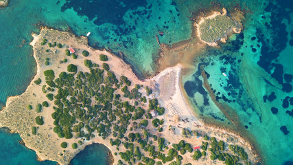 Autumn 2017: Aerial bird's eye view photo taken by drone depicting beautiful deep blue -  turquoise waters and rocky seascape