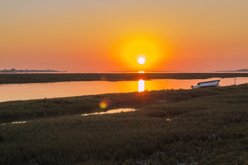 Algarve sunset seascape at Ria Formosa wetlands reserve, southern Portugal.