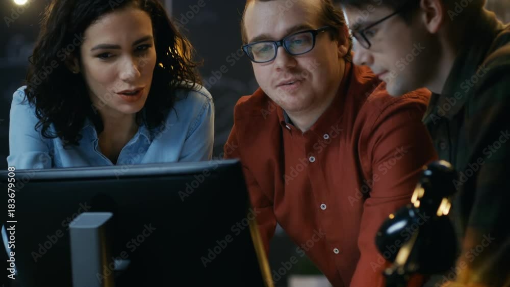 Poster three office employees have discussion about ongoing project, they point at personal computer screen
