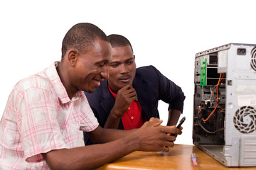 two computer scientists repair a computer