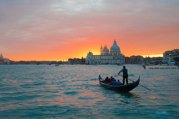 Beautiful sunset in Venice over canal. Gondola in sunset © zoya