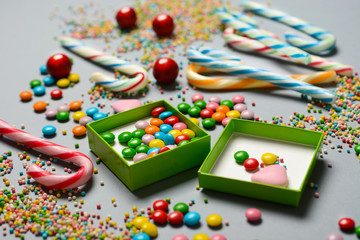 Fototapeta na wymiar pile of assorted and colored candies - closeup