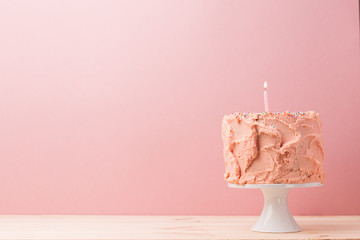 Delicious cake with lonely candle