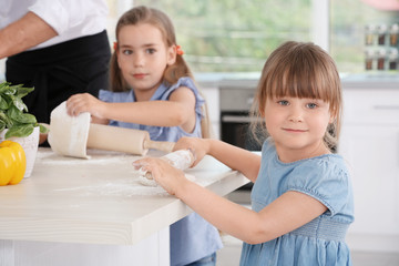 Cute children in kitchen during cooking classes