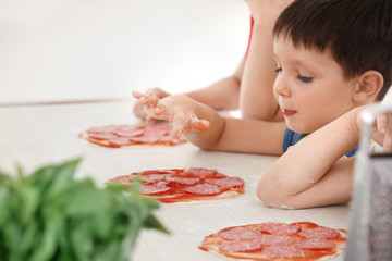 Cute children in kitchen during cooking classes