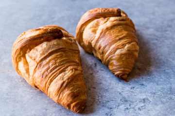 Freshly Baked Croissants on Blue Surface.