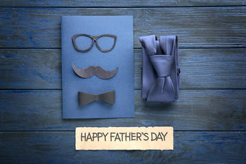 Happy Father's Day concept. Card and tie in gift box on wooden table