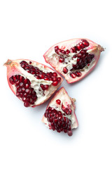 Red pomegranate open fruit isolated on white background.