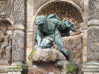 Bronze statue "Polyphemus Surprising Acis and Galatea" by sculptor Auguste Ottin on the Medici Fountain in the Jardin du Luxembourg, Paris.