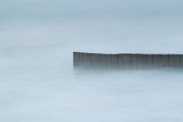 breakwaters in sea fog, long exposure