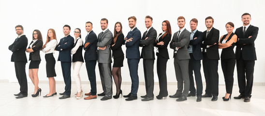 Obraz premium large business team standing arms crossed in front