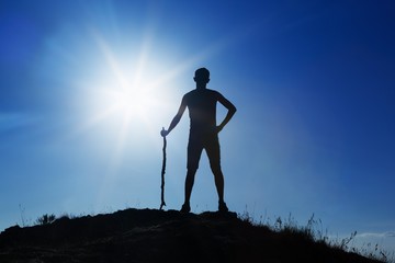 Man Standing Against Sun