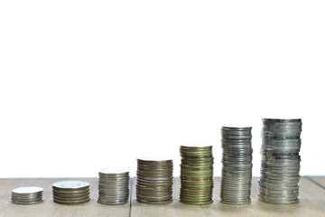 isolated coin pile stacked in increasing chart shape on white background