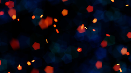 Bokeh orange embers and blue lights against a black background 