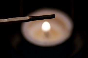Candle and match