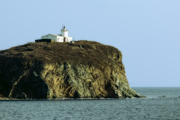 old lighthouse on rock island Skryplev near the city of Vladivostok Russia © vasilevich