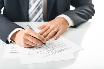 Closeup of a Businessman Signing a Contract