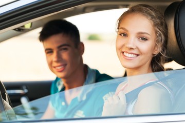 Portrait of Young Couple in a Car