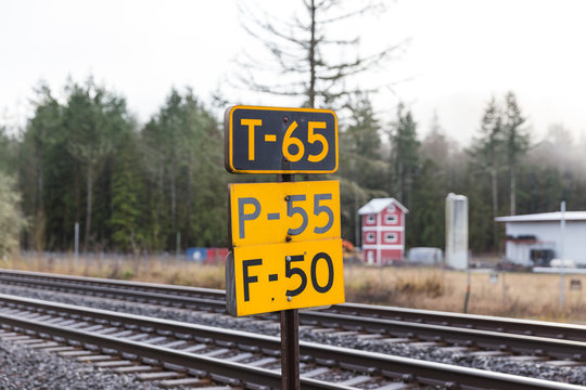 Railroad Signs Near Train Tracks
