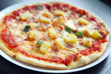Hawaiian pizza , Pizza with ham pineapple cheese on wood background