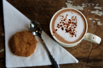 Hot chocolate on wood background