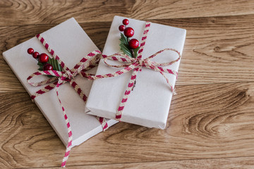 Wrapped Christmas presents on a wood background