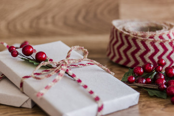 Wrapped Christmas presents on a wood background