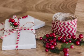 Wrapped Christmas presents on a wood background
