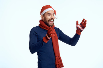 joyful man on a light background, new year, holiday, emotions