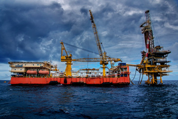 Fototapeta premium Oil rig tender type is working on oil and gas remote platform to completion gas reservoir well.
