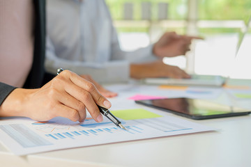 Start up partners are working in casual clothes  discussing the ideas for new strategy of development.