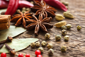  Various spices on a wooden surface closeup