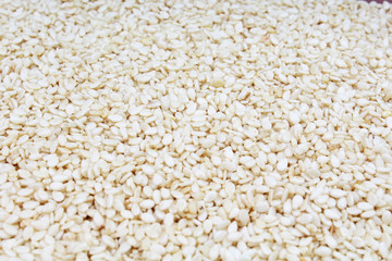 Sesame seed. Sesam seeds as texture pattern closeup background. Food photo.