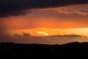 moody sunset dark horizon