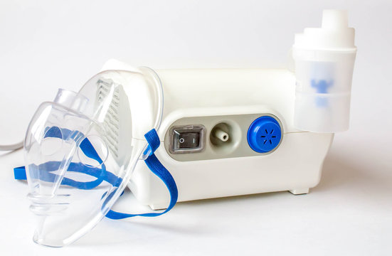 Medical Equipment For Inhalation, Respiratory Mask White Background. Compressor Nebulizer On White.