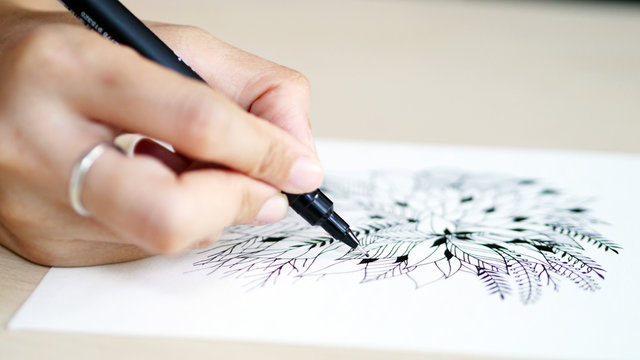 artist desk top view pen, pencil mandala flower floral hand drawing design illustration