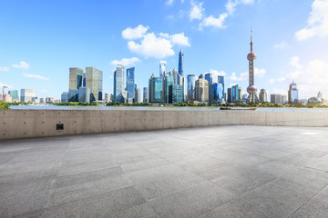 Fototapeta premium Empty city square floor and modern city commercial buildings scenery in Shanghai,China