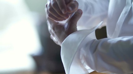 Man buttoning shirt closeup. Dressed man. Dressing up men's. Men hands.