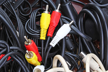 Red yellow white cables. Audio video cable cord texture pattern as background. Cables.