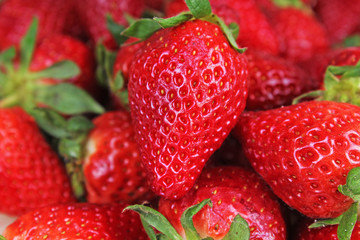 Red sweet strawberry texture as background. Strawberries pattern red whole big strawberries. Foog photo.