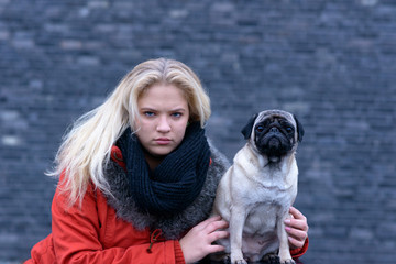 Young woman with her pug