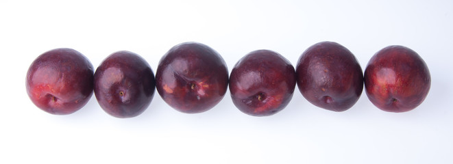 Plum. Ripe plum fruit on background