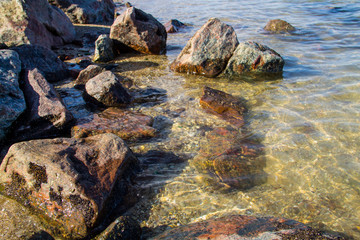 Sea waves splashing over rocks