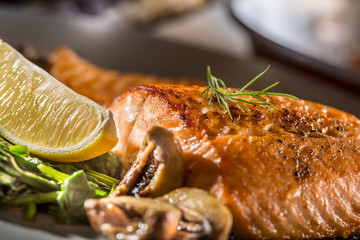 Salmon Roast Fillet. Portion of roast salmon fillet with spinach mushrooms in restaurant pub home or hotel