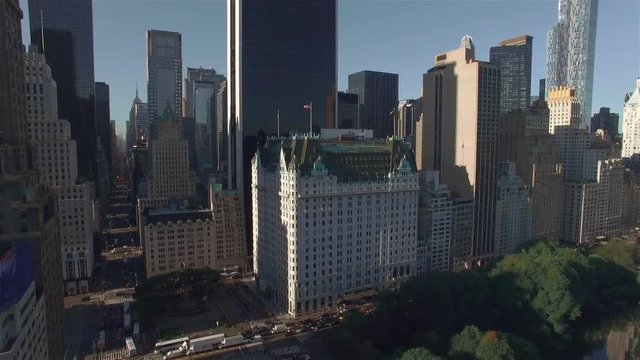 Aerial real time shot, camera is hovering above Central park and filming intersection between West 95th Street and Fifth Avenue