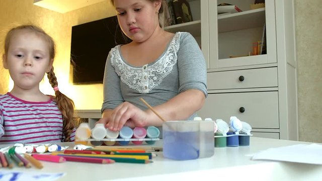 Children paint with gouache.