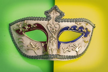 carnival mask on color background