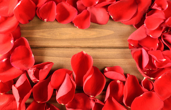 Red rose petal frame on wooden plank background - Powered by Adobe