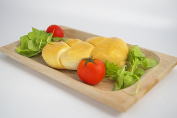 scamorza cheese with cherry tomatoes and lettuce